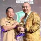 Penyerahan Penghargaan Universal Health Coverage (UHC) Kepada Pemerintah Daerah di Balai Sudirman Jakarta Selasa (14/3).