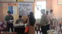 Bhabinkamtibmas Polres Lebak Laksanakan Pengamanan Bantuan Sembako Dari BPN I Teras Media