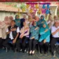 Foto bersama petugas Puskesmas Kemiri, kader posyandu, dan warga di sela kegiatan Grebeg Posyandu Januari 2026.