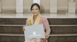 Keterangan foto : Jessy Wijaya (30) dalam prosesi wisuda Program Pascasarjana Universitas Gadjah Mada (UGM), Sabtu (2/5/2026)