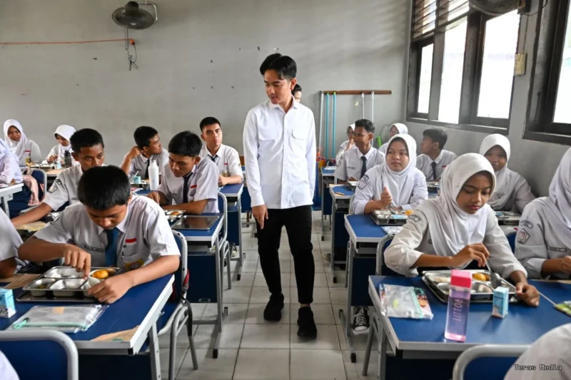 Students engage with a teacher in an interactive classroom session.