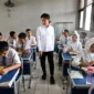 Students engage with a teacher in an interactive classroom session.